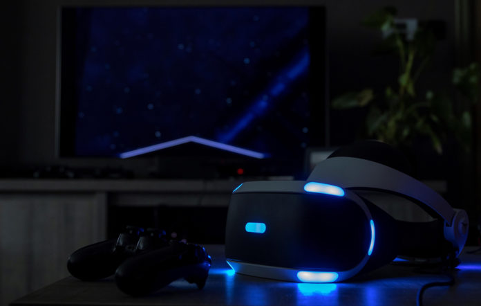 psvr2 with ps4 on a table with neon lights