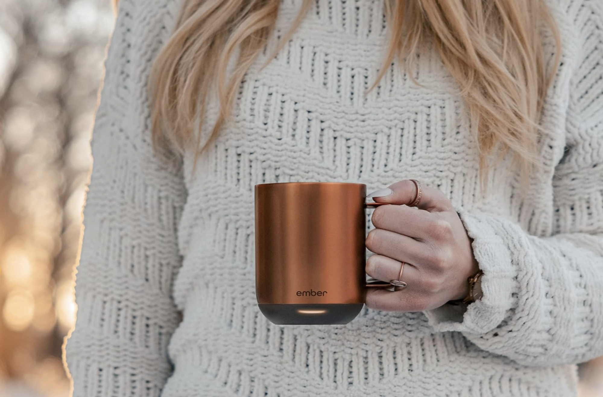 Woman holding ember mug