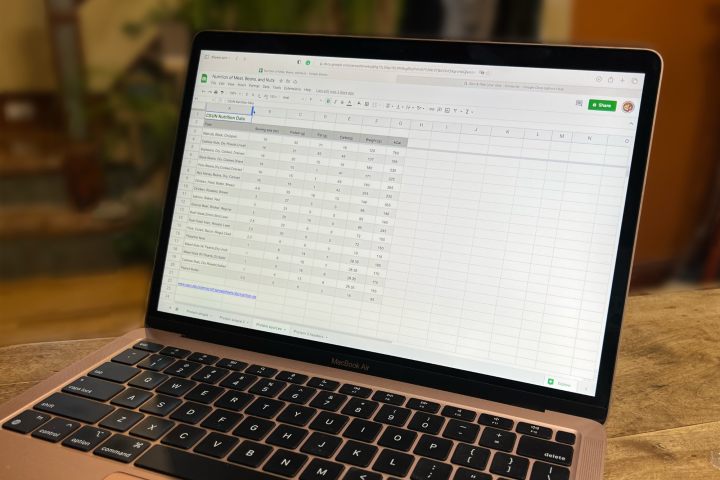 Google Sheets displayed on a MacBook Air.