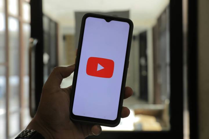 YouTube logo on phone screen