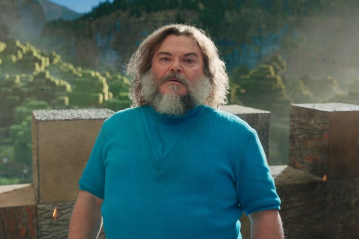 Jack Black near a castle wall in A Minecraft Movie.