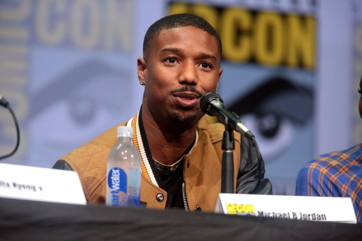 Michael B. Jordan at a podium discussing his new project.