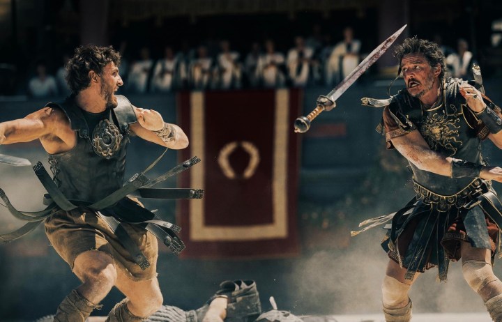 Paul Mescal and Pedro Pascal wield swords.