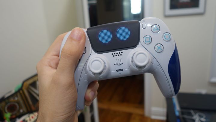 An individual holding the Astro Bot DualSense controller.