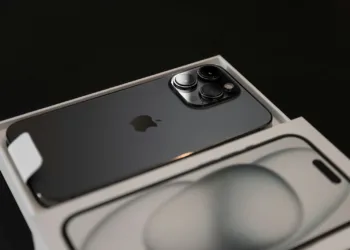 an iphone in a box on a black background