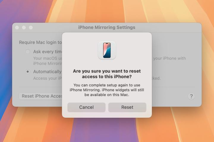 A window giving a user the option to reset iPhone Mirroring and disconnect their iPhone from their Mac in macOS Sequoia.