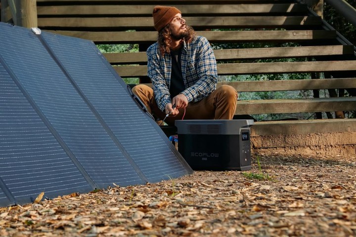 A man using the EcoFlow Delta 2 Max outdoors.