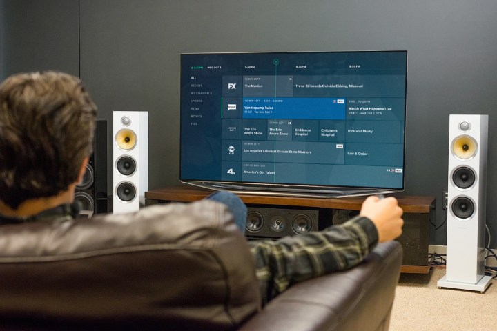 A person relaxing on a couch watching Hulu.