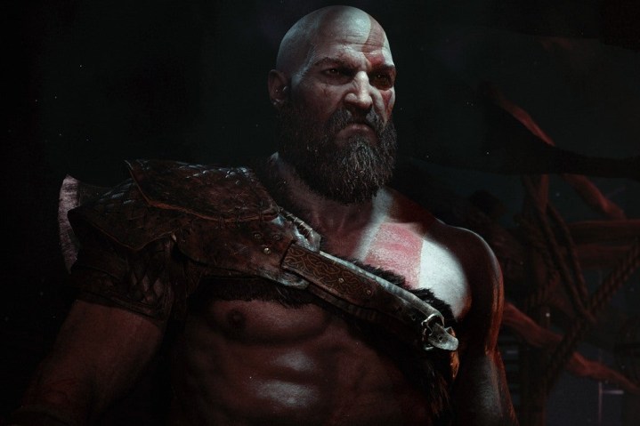 Kratos stands in a cabin in God of War.