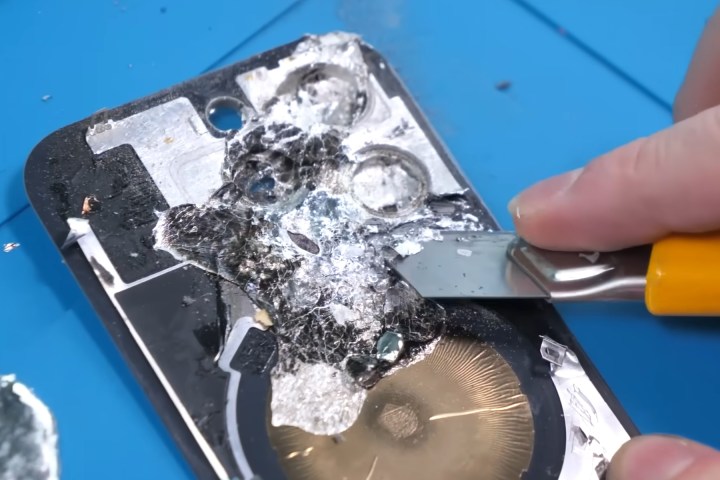 Cleaning the glass rear shell on an iPhone 16 Pro.