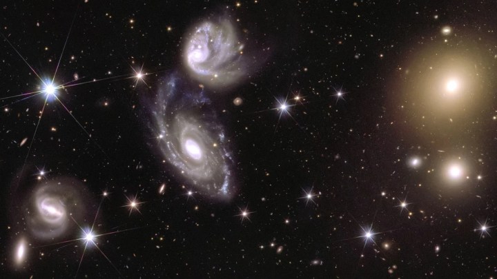 This image shows an area of the mosaic released by ESA’s Euclid space telescope on 15 October 2024. The area is zoomed in 150 times compared to the large mosaic. On the left of the image, Euclid captured two galaxies (called ESO 364-G035 and G036) interacting with each other, 420 million light-years from us. On the right of the image, galaxy cluster Abell 3381 is visible, 678 million light-years away from us.