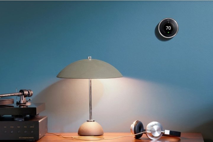 Google Nest Learning Thermostat on a wall in an office setting.