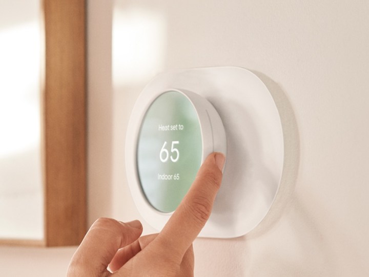 Adjusting settings on the Google Nest Thermostat.