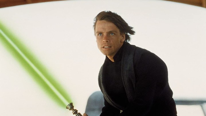 Luke Skywalker wielding his signature green lightsaber in RotJ.