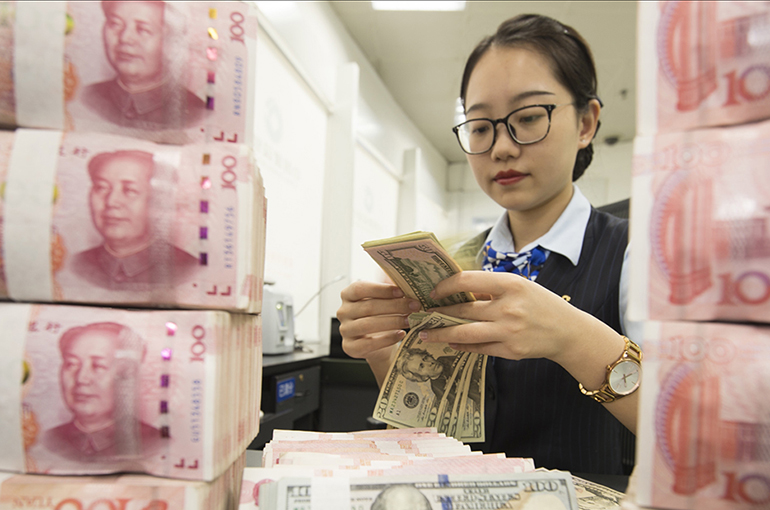 US Dollar Surge Dims Yuan: Experts Predict Fluctuating Exchange Rates