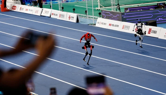 Can Robots Outrun Humans Yet Still Plug In a Cable?